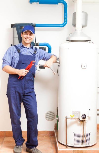 plumber working on water heater